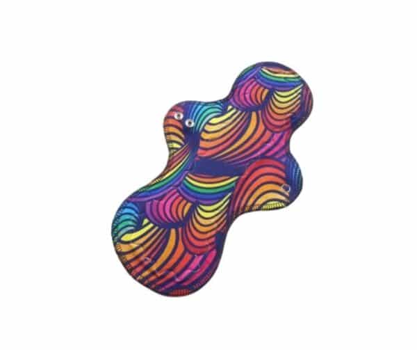 Pictured is a Sergio shaped cloth sanitary pad with a rainbow waves organic cotton jersey top fabric.