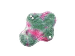 A reusable cloth menstrual pad with hand-dyed organic cotton sherpa and organic merino wool interlock backing.