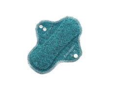 A zero waste sustainable cloth menstrual pad with organic cotton jersey top and organic interlock wool backing.