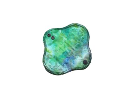 Pictured is a 6" light absorbency zero waste cloth sanitary pad. It is topped with a Mediteranean blue and green Batik cotton fabric and backed with softshell fleece.